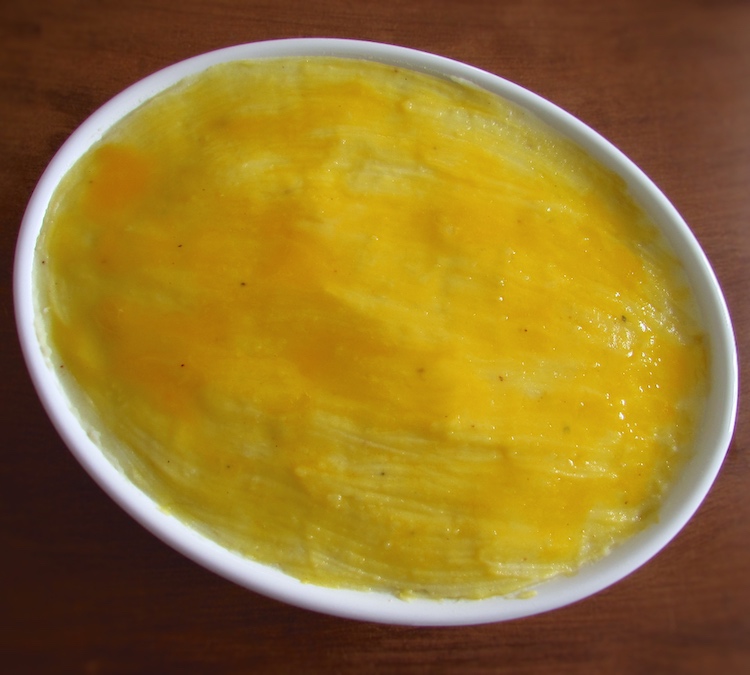 Meat with puree brushed with beaten egg yolk