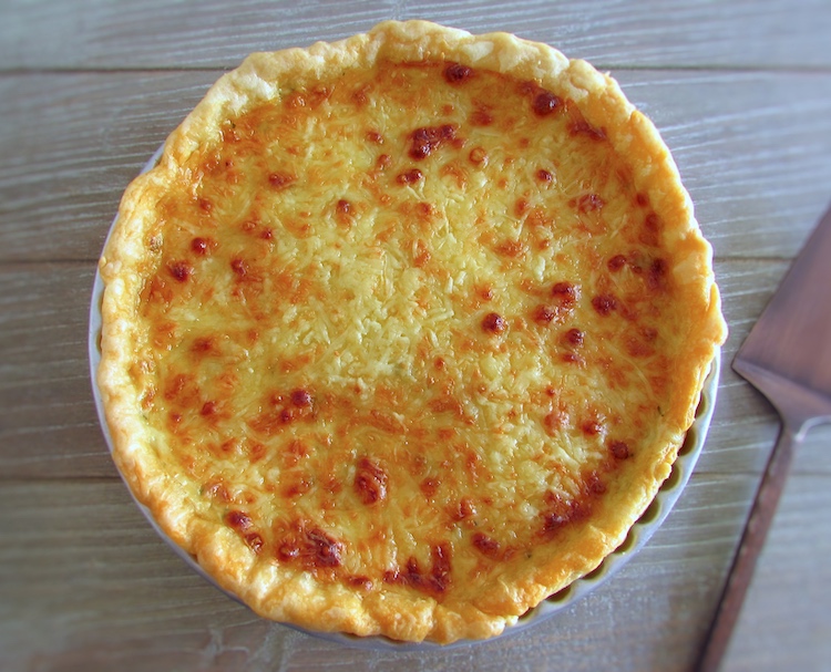 Tuna and chouriço pie on a pie pan