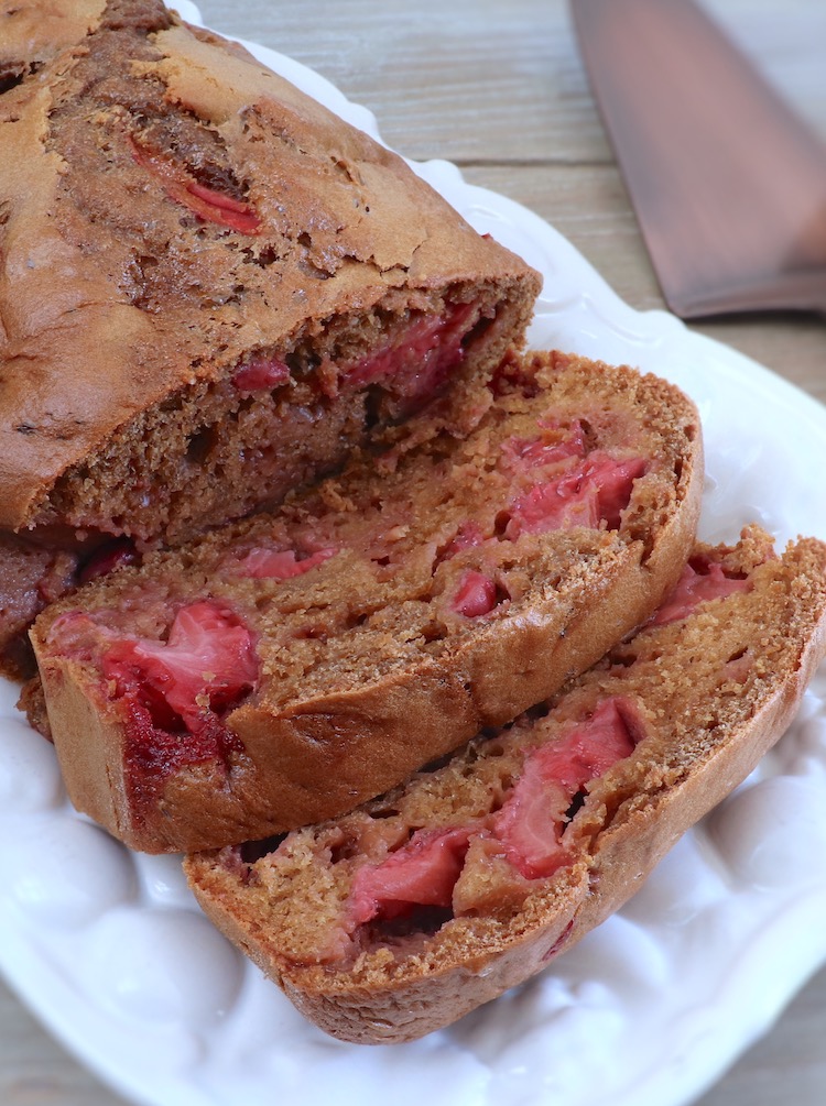 Strawberry loaf cake slices on a rectangular platter