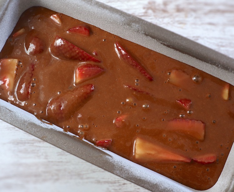 Strawberry cake batter on a loaf pan