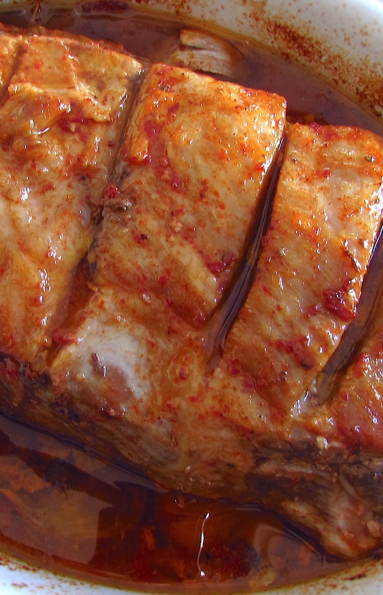 Baked pork ribs with beer on a baking dish