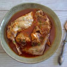 Rabbit stew with spices on a plate with a fork