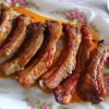 Delicious and simple pork ribs on a platter with a fork