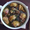 Stewed chicken with red wine on a dish