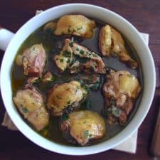 Stewed chicken with red wine on a dish