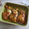 Roasted chicken legs on a baking dish