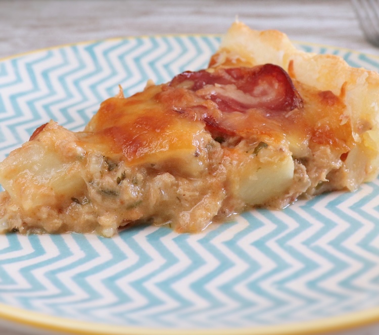 Slice of tuna and potato pie with Portuguese sausage in a plate