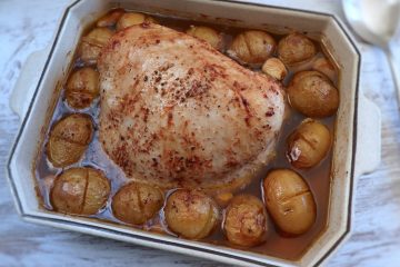 Turkey loin with potatoes in the oven on a baking dish