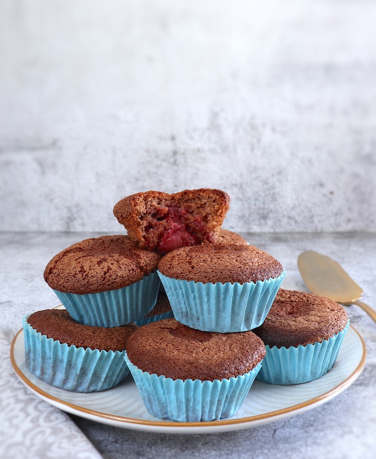 Chocolate muffins with strawberries on a plate