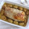 Roasted pork loin with rosemary and honey on a baking dish