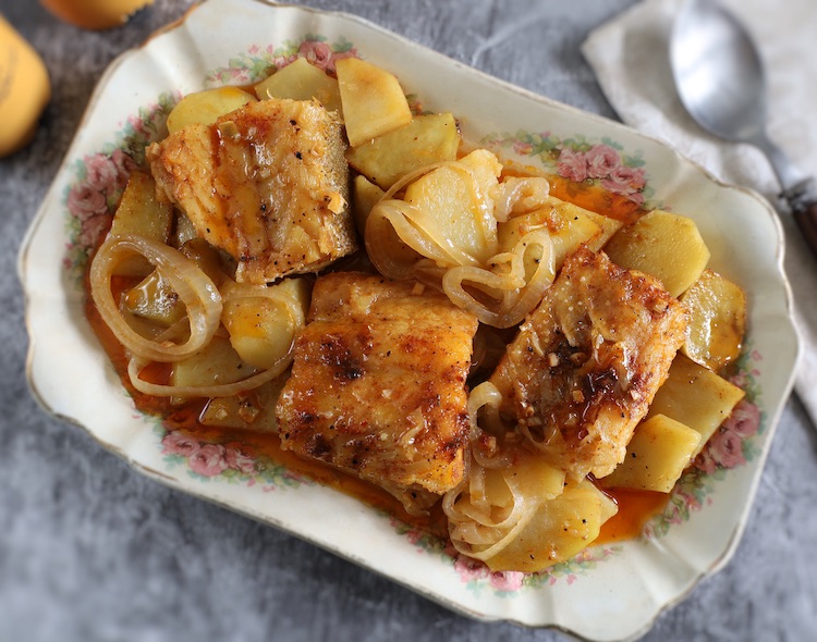 Easy Baked Cod with Potatoes in a rectangular platter