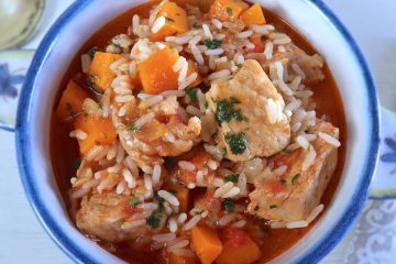 Pork stew with rice and carrot on a tureen