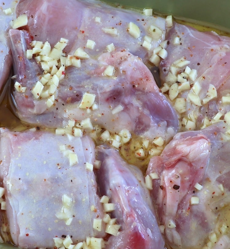 Rabbit on a baking dish seasoned with homemade sauce
