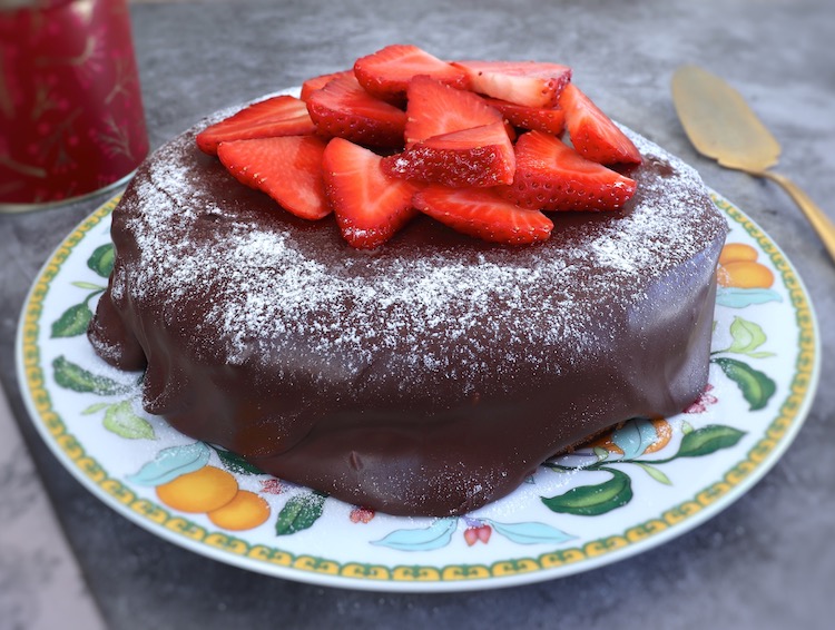 Strawberry cake with chocolate frosting on a plate