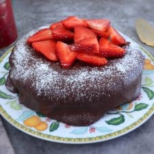 Strawberry cake with chocolate frosting on a plate