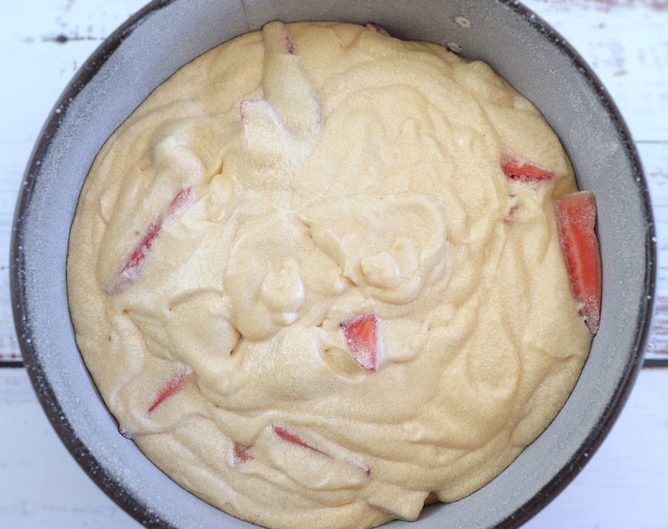 Dough of strawberry cake on a round cake pan