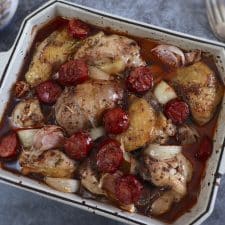 Baked chicken with chouriço on a baking dish