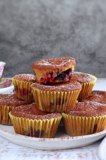 Orange triple berry muffins on a plate