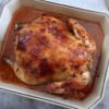 Honey lemon roast chicken in a baking dish