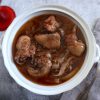 Chicken stew with red wine and rosemary on a tureen