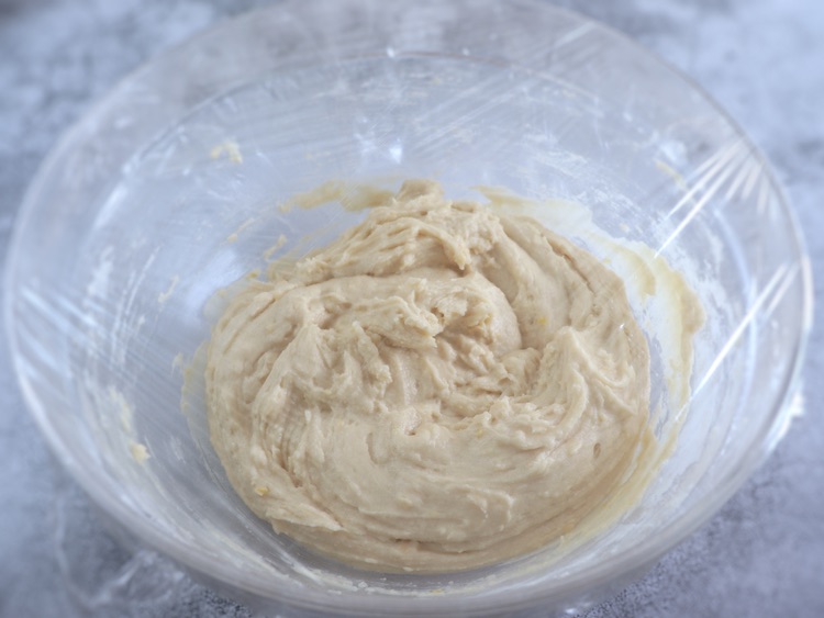 Lemon dough on a large dish bowl covered with cling film