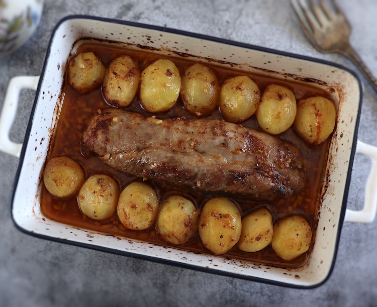 Easy baked pork tenderloin on a baking dish