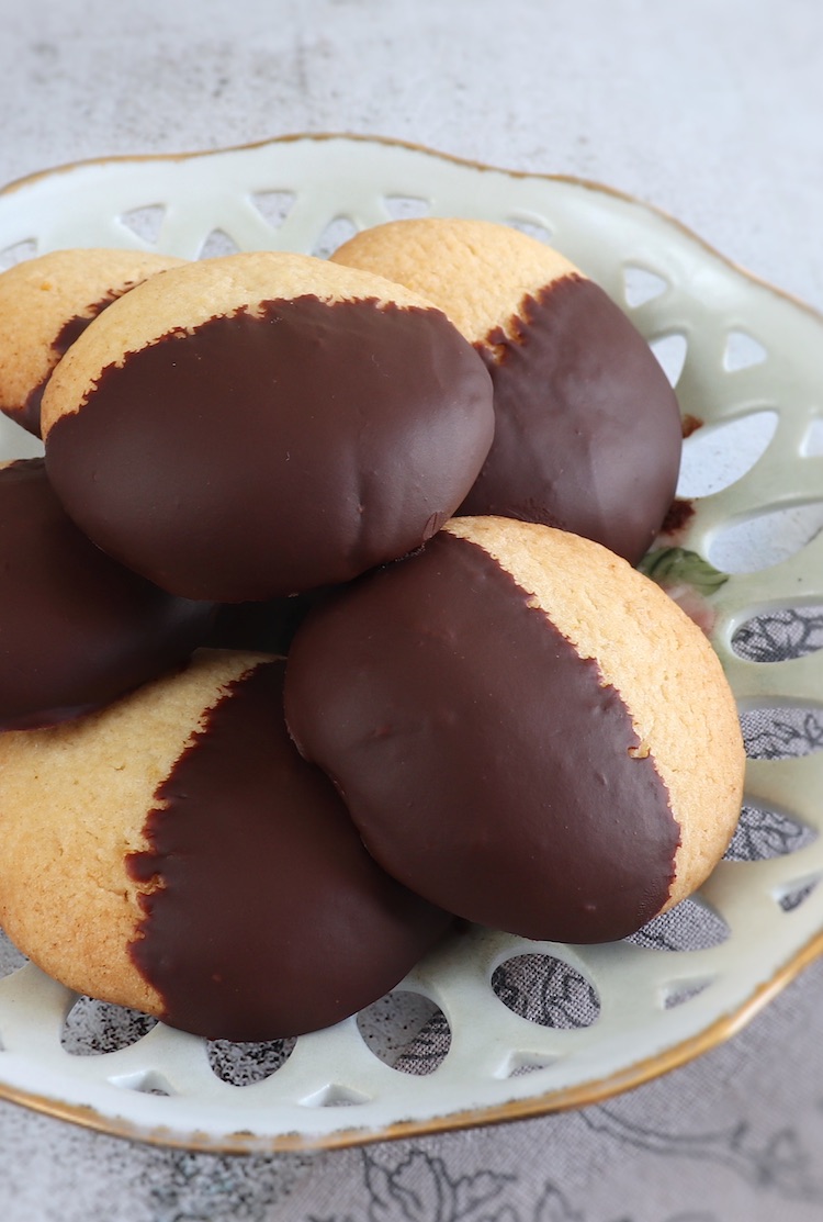 Chocolate dipped shortbread cookies on a plate