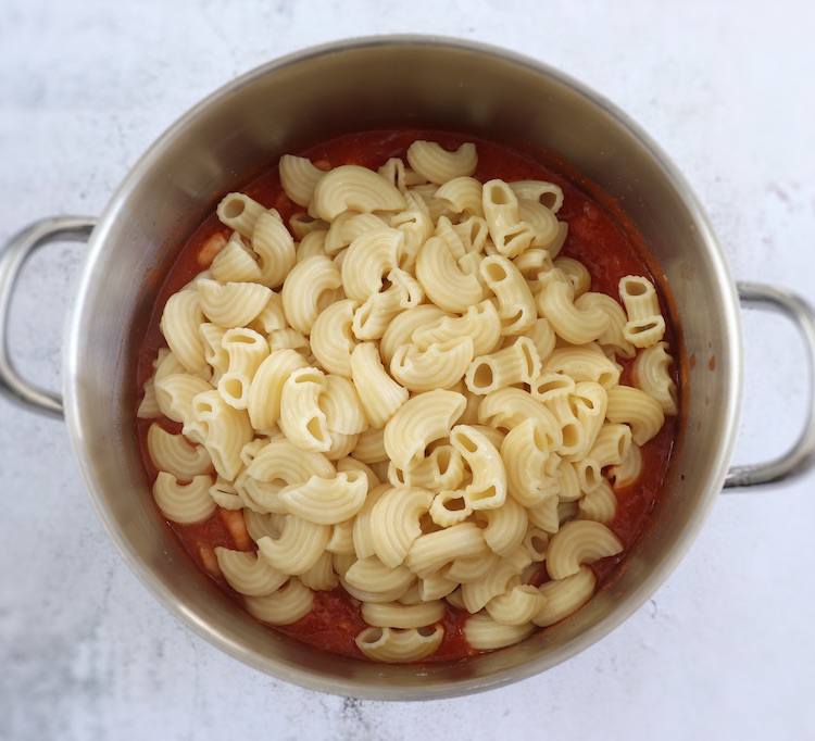 Shrimp and elbow macaroni in a large saucepan