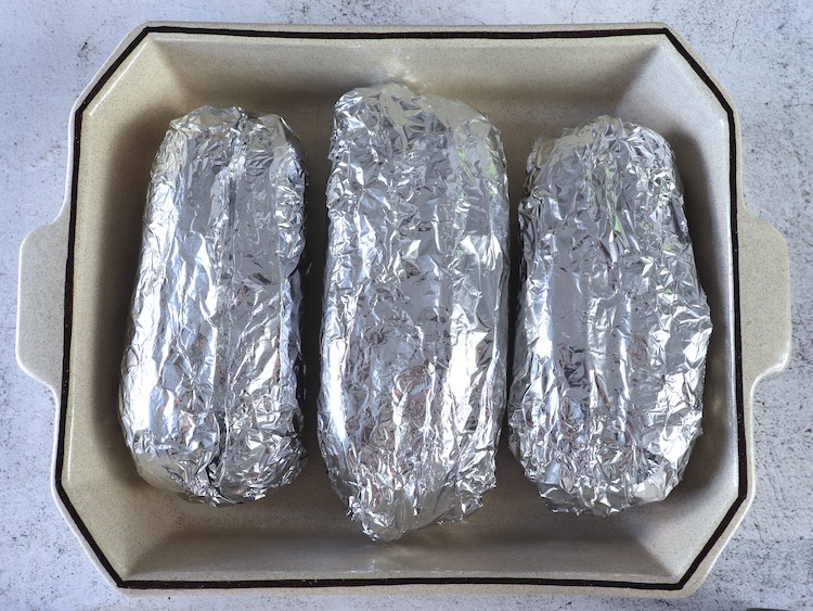 Easy cheesy garlic bread wrapped in aluminium foil