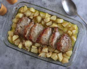 Easy roasted pork loin with potatoes on a baking dish