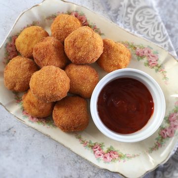 Homemade chicken nuggets on a rectangular platter