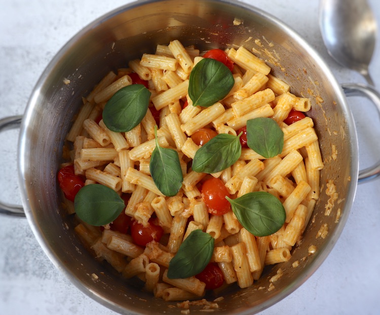 Easy Parmesan pasta with cherry tomato on a large saucepan