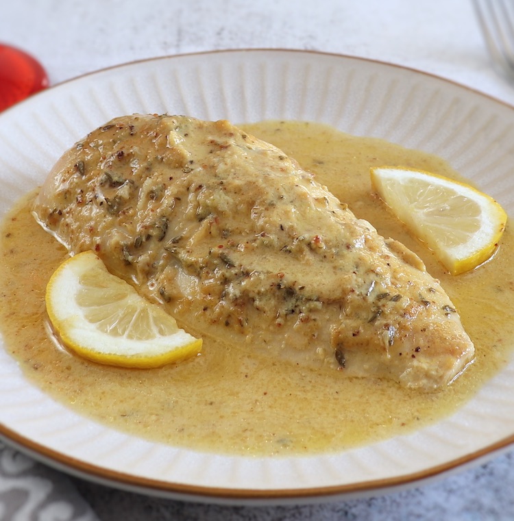 Baked Chicken Breast with Lemon Mustard Sauce on a plate