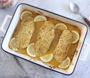 Baked Chicken Breast with Lemon Mustard Sauce in a baking dish