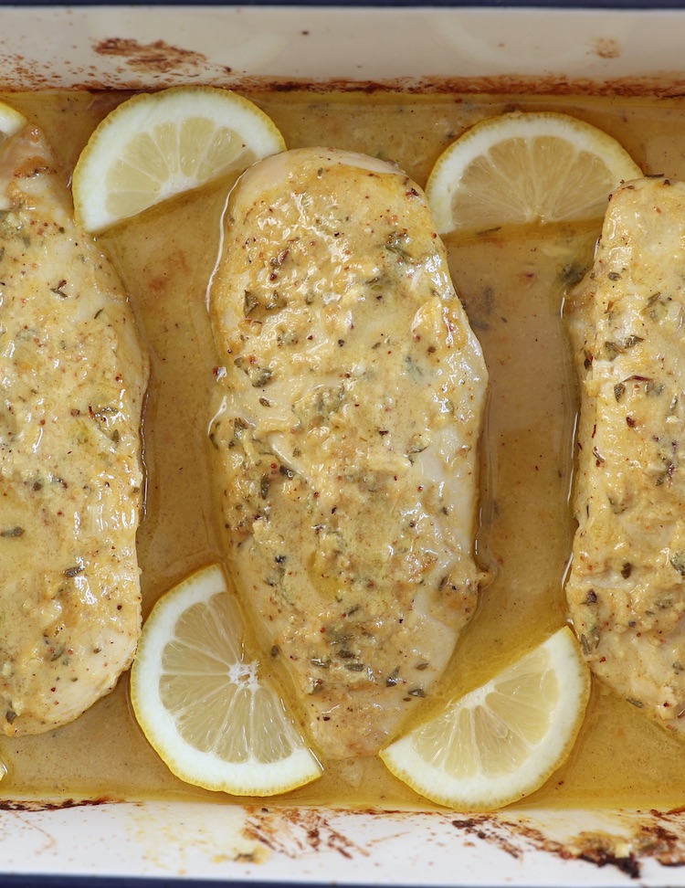 Baked Chicken Breast with Lemon Mustard Sauce in a baking dish