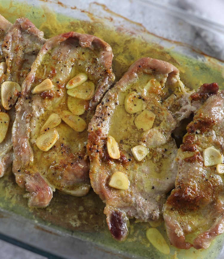 Best and Easy Baked Pork Steaks on a glass baking dish
