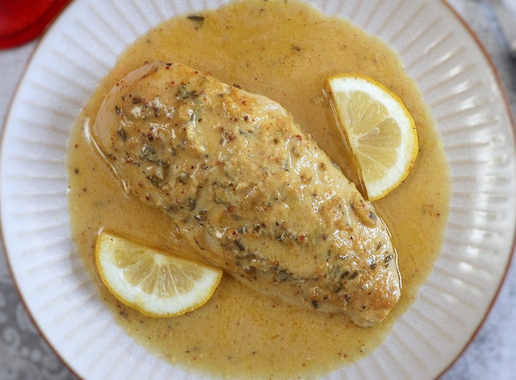 Baked Chicken Breast with Lemon Mustard Sauce on a plate