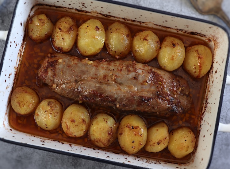 Easy baked pork tenderloin on a baking dish