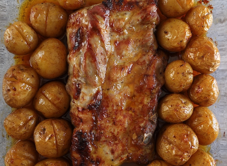 Tender Oven Baked Ribs in a glass baking dish