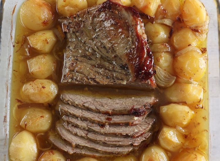 Traditional roast veal on a glass baking dish